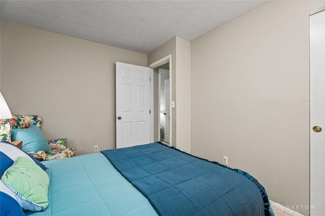 bedroom featuring a textured ceiling