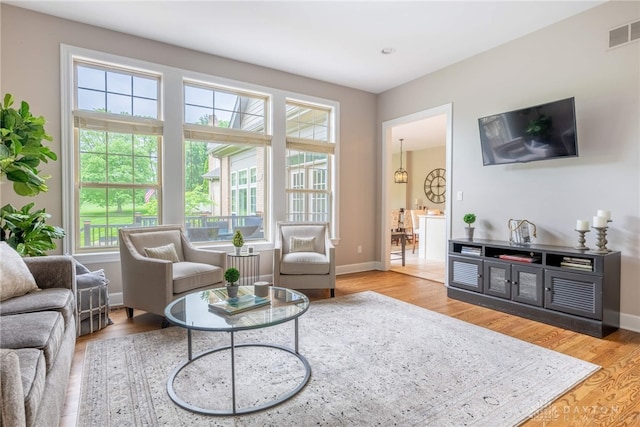 living room with wood finished floors and baseboards