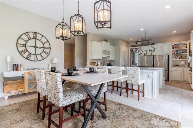 dining room with a chandelier, light tile patterned flooring, and recessed lighting