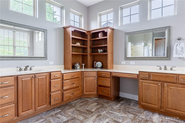 full bathroom featuring vanity, a high ceiling, and a shower