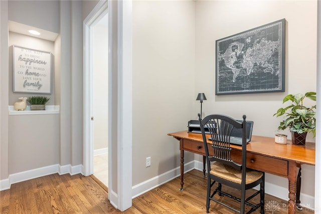 office featuring wood finished floors and baseboards