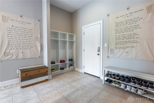 mudroom featuring tile patterned floors and baseboards