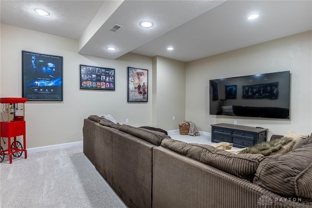 living room featuring carpet, baseboards, recessed lighting, and a textured ceiling