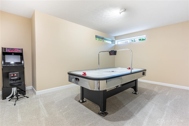 recreation room featuring baseboards and carpet floors
