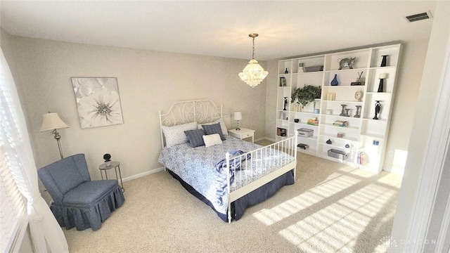 bedroom with carpet floors, a chandelier, and baseboards