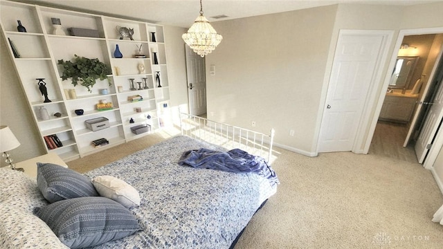bedroom featuring a chandelier, carpet flooring, and baseboards