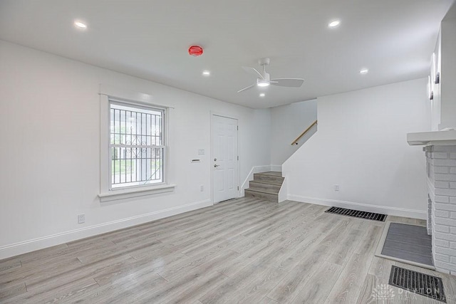 3200 Hoover Ave, Dayton, OH 45402 - unfurnished living room with light wood finished floors, stairs, ceiling fan, recessed lighting, and baseboards
