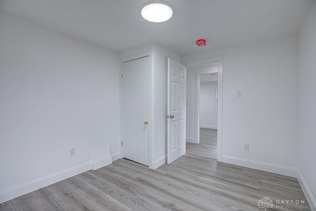 3200 Hoover Ave, Dayton, OH 45402 - unfurnished bedroom with light wood-style floors and baseboards