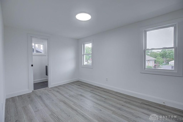 3200 Hoover Ave, Dayton, OH 45402 - unfurnished bedroom with light wood finished floors and baseboards