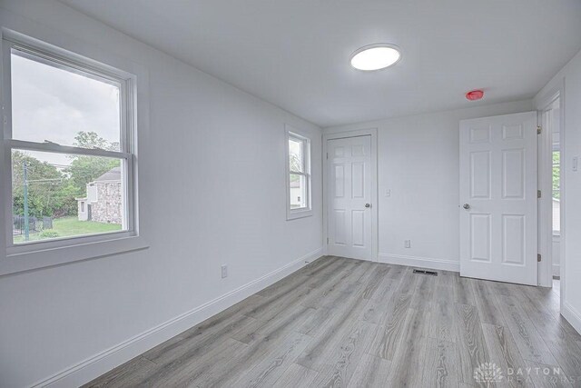 3200 Hoover Ave, Dayton, OH 45402 - unfurnished bedroom featuring light wood-style flooring and baseboards