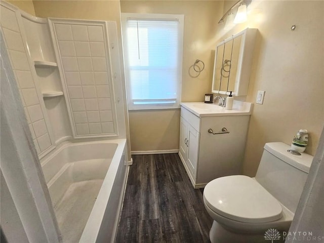 full bath with toilet, vanity, wood finished floors, and healthy amount of natural light