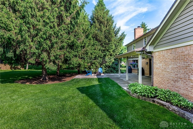 2100 Hunters Bluff Ct, Washington Twp, OH 45458 - view of green lawn with a patio area