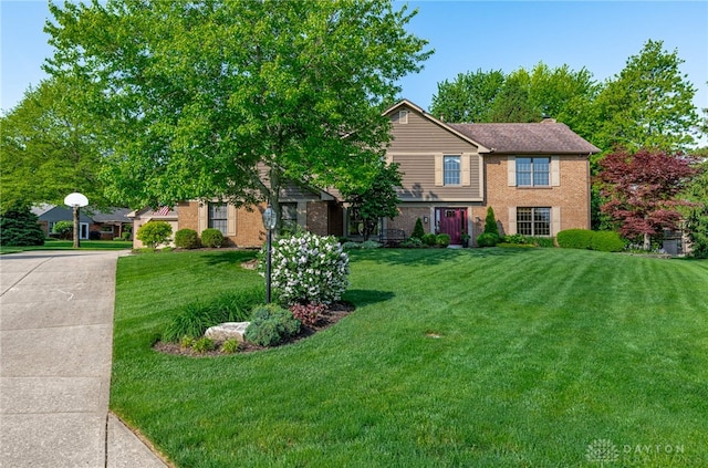 2100 Hunters Bluff Ct, Washington Twp, OH 45458 - view of front of home featuring a front yard, brick siding, and driveway