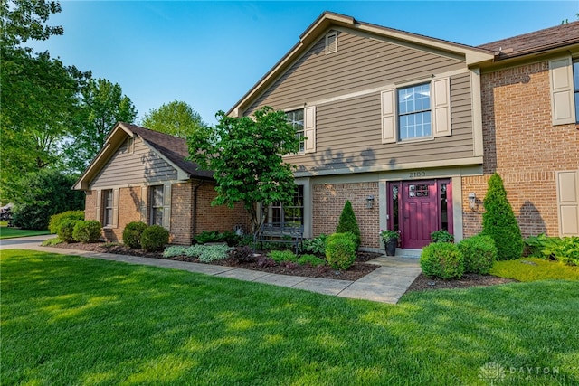 2100 Hunters Bluff Ct, Washington Twp, OH 45458 - view of front of house with brick siding and a front lawn