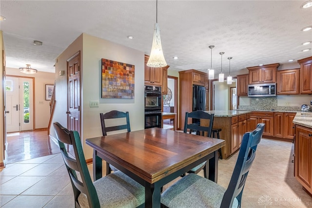 2100 Hunters Bluff Ct, Washington Twp, OH 45458 - dining area with light tile patterned floors, recessed lighting, and a textured ceiling