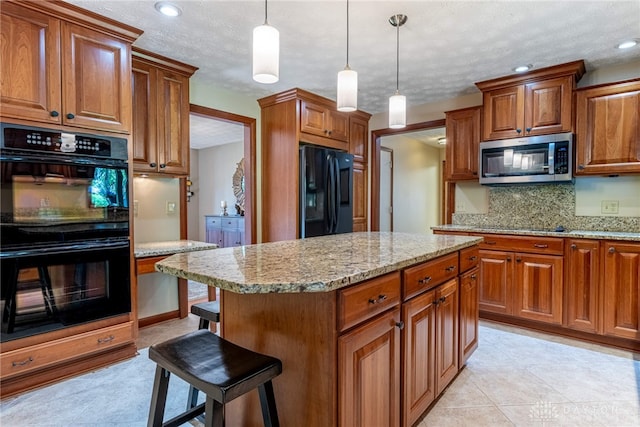 2100 Hunters Bluff Ct, Washington Twp, OH 45458 - kitchen with black appliances, brown cabinetry, tasteful backsplash, a kitchen bar, and light stone counters