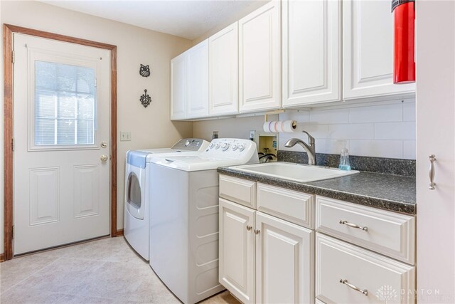 2100 Hunters Bluff Ct, Washington Twp, OH 45458 - washroom with cabinet space, washing machine and clothes dryer, and light tile patterned floors