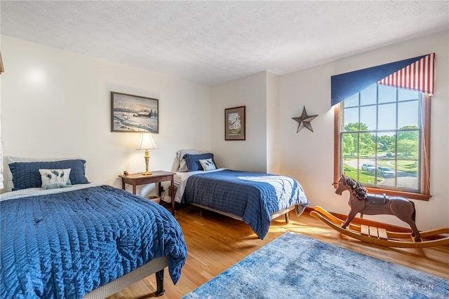2100 Hunters Bluff Ct, Washington Twp, OH 45458 - bedroom featuring a textured ceiling and wood finished floors