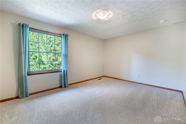 2100 Hunters Bluff Ct, Washington Twp, OH 45458 - carpeted spare room with baseboards and a textured ceiling