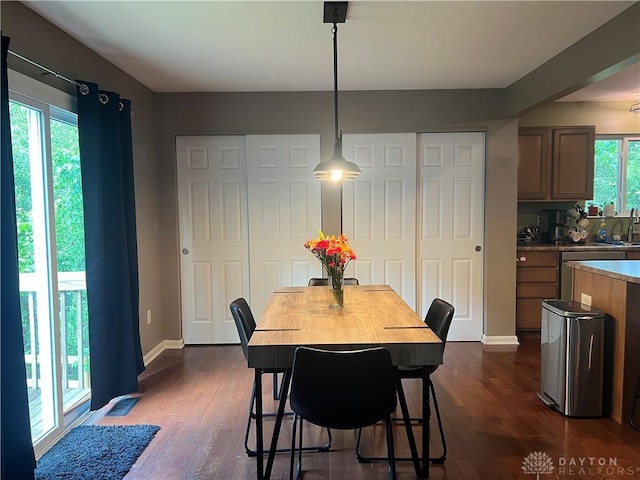 868 Grande Oaks Dr, Morrow, OH 45152 - dining area with dark wood-style floors and baseboards