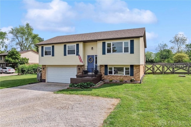 7217 State Route 380, Chester Twp, OH 45177 - bi-level home with brick siding, dirt driveway, a garage, and a gate