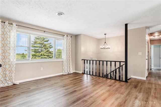 7217 State Route 380, Chester Twp, OH 45177 - empty room featuring wood finished floors and baseboards