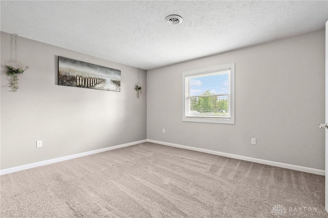 7217 State Route 380, Chester Twp, OH 45177 - spare room featuring carpet flooring, baseboards, and a textured ceiling