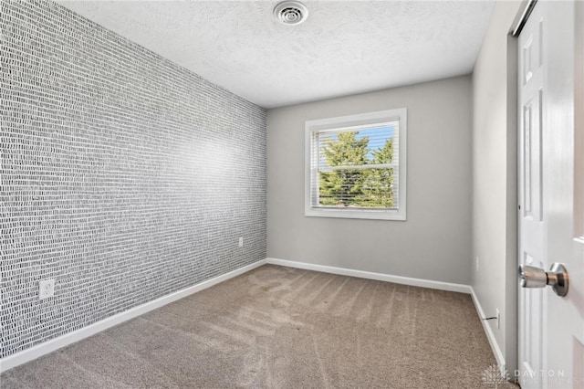 7217 State Route 380, Chester Twp, OH 45177 - empty room with baseboards, carpet floors, a textured ceiling, and an accent wall