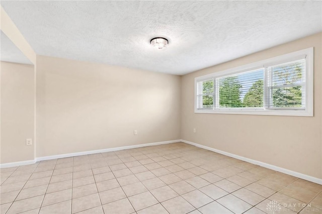 7217 State Route 380, Chester Twp, OH 45177 - spare room with a textured ceiling, baseboards, and light tile patterned floors