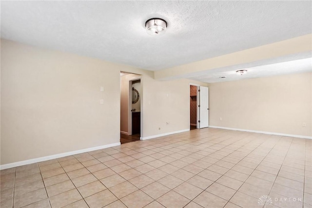 7217 State Route 380, Chester Twp, OH 45177 - empty room featuring baseboards and light tile patterned flooring