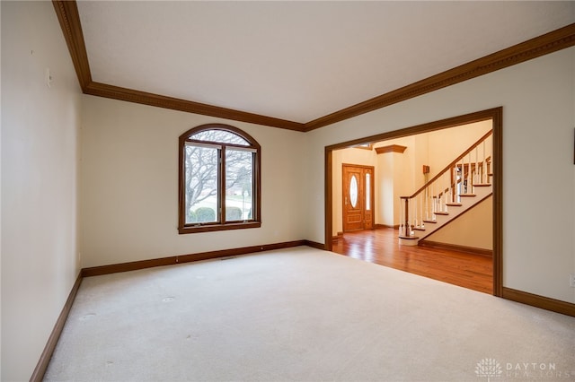 1656 Fox Trl, Bellbrook, OH 45305 - unfurnished room with carpet floors, crown molding, baseboards, and stairs