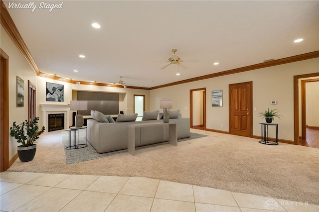 1656 Fox Trl, Bellbrook, OH 45305 - carpeted living area with recessed lighting, a ceiling fan, crown molding, baseboards, and a glass covered fireplace