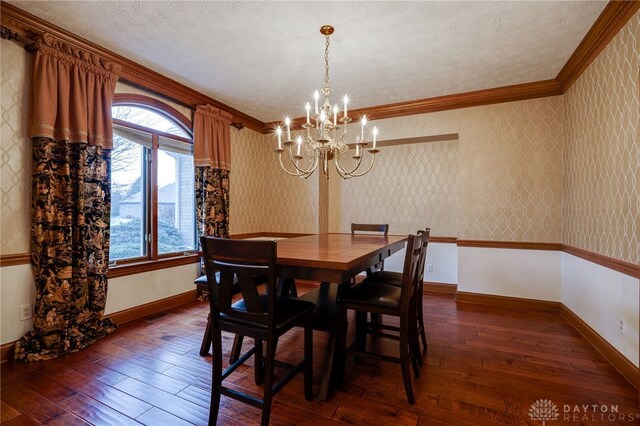 1656 Fox Trl, Bellbrook, OH 45305 - dining area with a chandelier, dark wood-type flooring, baseboards, wallpapered walls, and ornamental molding