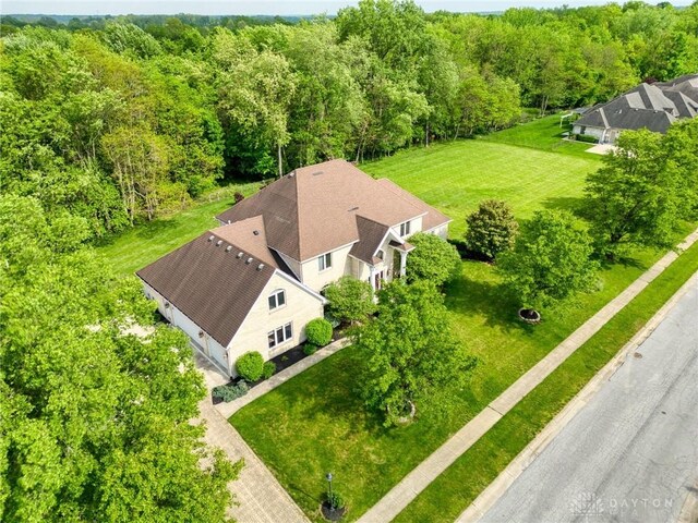 1656 Fox Trl, Bellbrook, OH 45305 - aerial view of property and surrounding area featuring a heavily wooded area