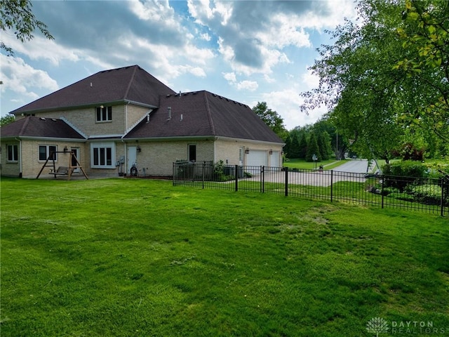 1656 Fox Trl, Bellbrook, OH 45305 - rear view of house with a garage and brick siding