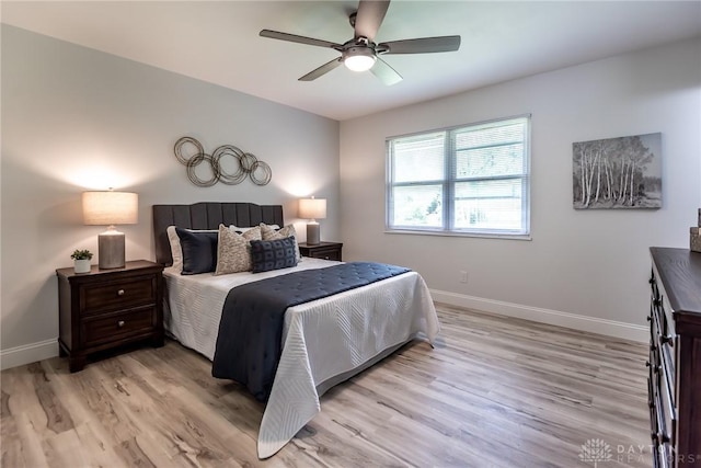 6399 Kimberly Dr, Fairfield Twp, OH 45011 - bedroom with baseboards, light wood-type flooring, and ceiling fan