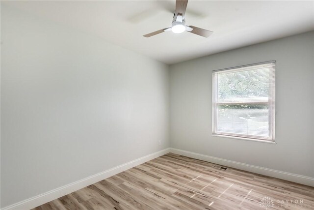 6399 Kimberly Dr, Fairfield Twp, OH 45011 - empty room featuring light wood finished floors, baseboards, and ceiling fan