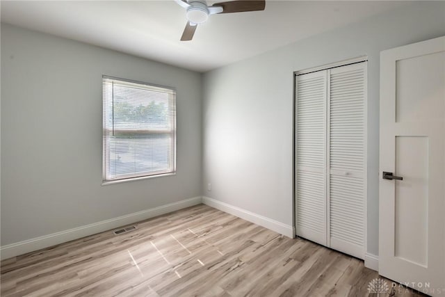 6399 Kimberly Dr, Fairfield Twp, OH 45011 - unfurnished bedroom featuring a closet, light wood-type flooring, baseboards, and ceiling fan