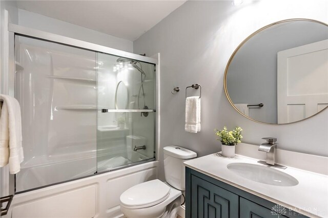 6399 Kimberly Dr, Fairfield Twp, OH 45011 - full bath featuring toilet, vanity, and shower / bath combination with glass door