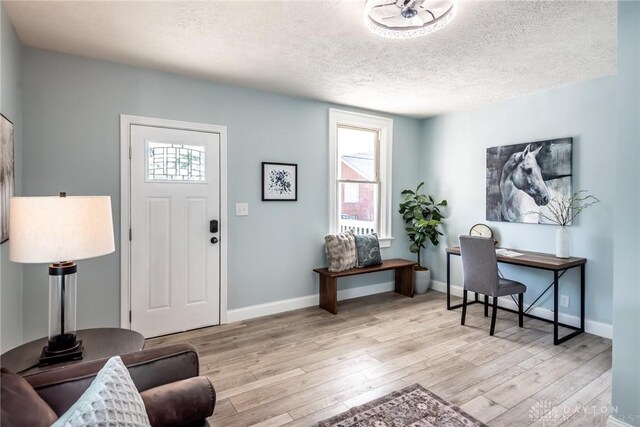 919 Summer St, Hamilton, OH 45013 - entryway with a textured ceiling, wood finished floors, and baseboards