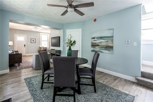 919 Summer St, Hamilton, OH 45013 - dining space with a ceiling fan, light wood finished floors, and baseboards