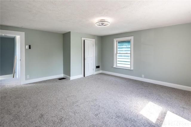 919 Summer St, Hamilton, OH 45013 - carpeted spare room with a textured ceiling and baseboards