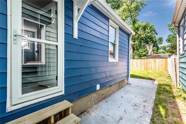 919 Summer St, Hamilton, OH 45013 - view of property exterior with fence and a patio