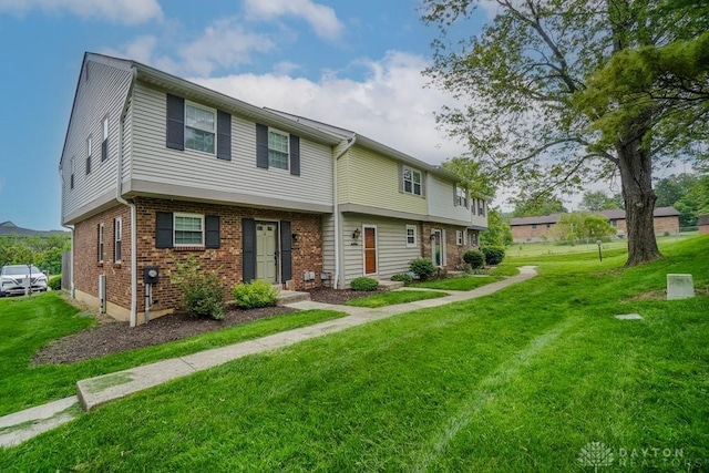7616 Pons Ln, West Chester, OH 45069 - view of property with a front yard and brick siding