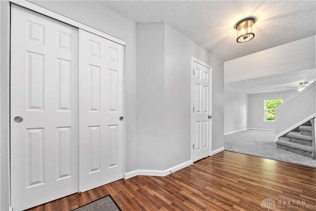 5065 Cross Creek Ln, Miami Township, OH 45150 - entryway featuring baseboards, stairs, wood finished floors, and a textured ceiling
