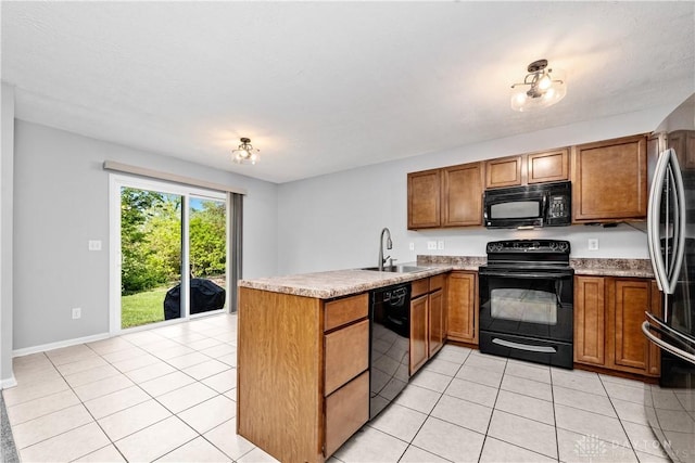5065 Cross Creek Ln, Miami Township, OH 45150 - kitchen with black appliances, a sink, a peninsula, and brown cabinets