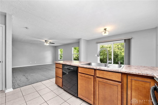 5065 Cross Creek Ln, Miami Township, OH 45150 - kitchen featuring black dishwasher, a sink, light carpet, brown cabinets, and ceiling fan