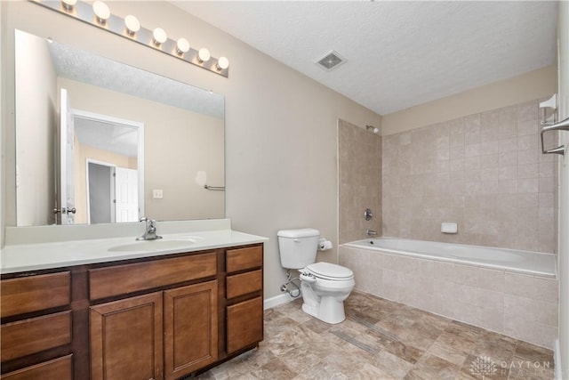 5065 Cross Creek Ln, Miami Township, OH 45150 - full bathroom featuring toilet, vanity, tiled shower / bath combo, baseboards, and a textured ceiling