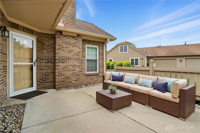 view of patio / terrace with an outdoor hangout area and fence