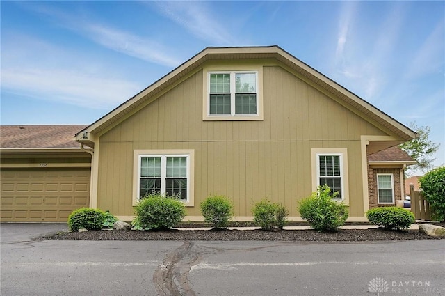 view of side of home with a garage